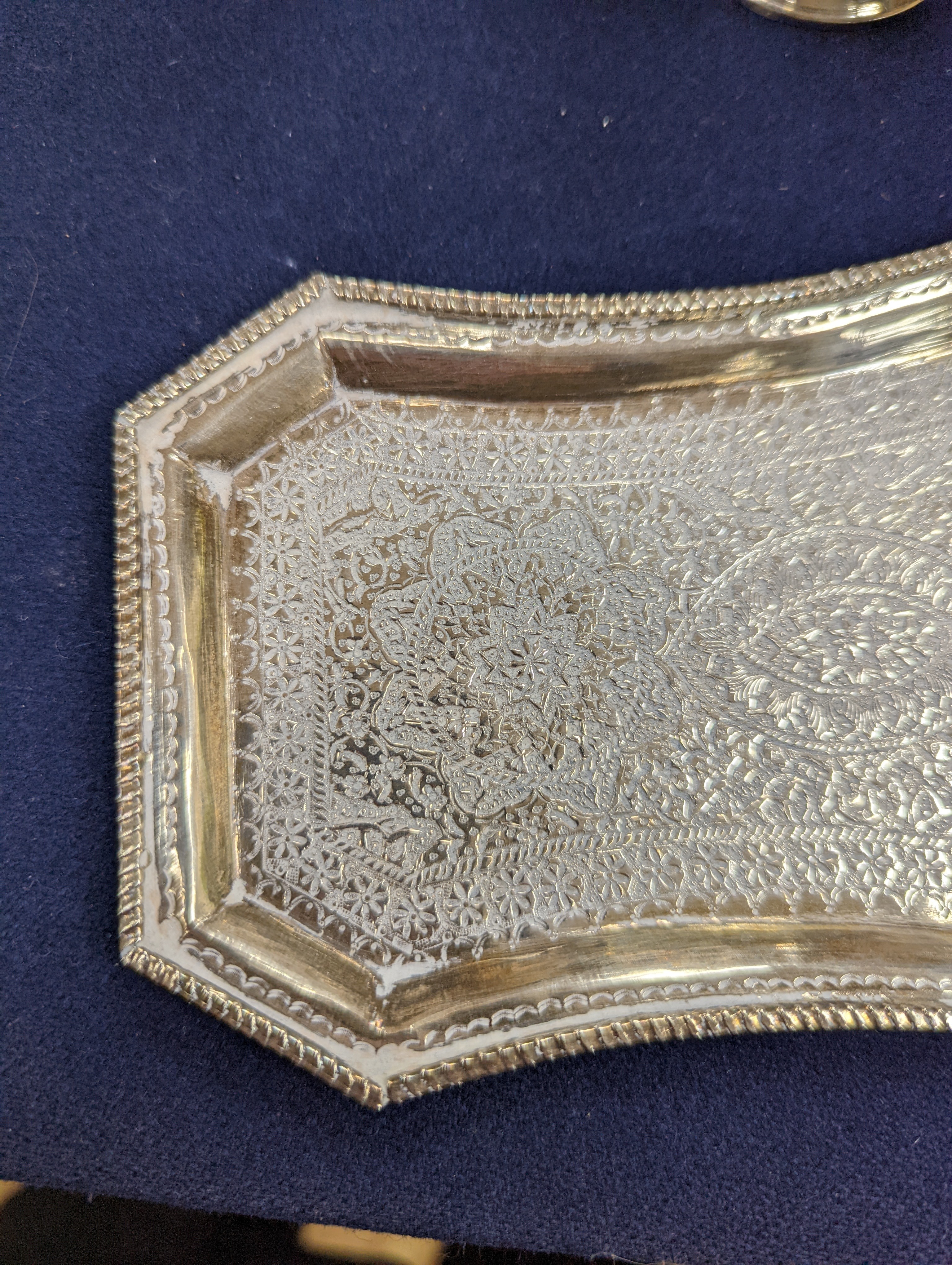 A set of six Persian embossed 84 standard white metal coffee cup holders and matching sugar bowl and cover by Vartan and four other Persian white metal items.